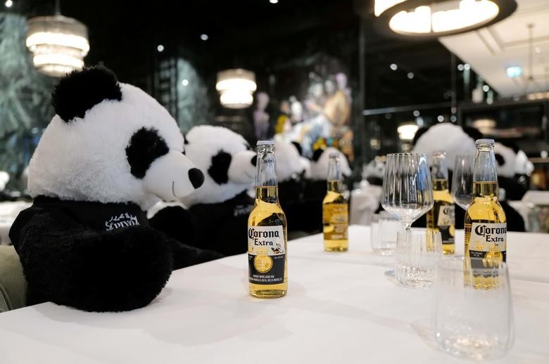 Fluffy toy panda bears as part of the art installation "Panda mie" by Italian restaurant owner Giuseppe "Pino" Fichera sit over beers at his restaurant "Pino's" to raise awareness of the COVID-19 lockdown's business impact on gastronomy in Frankfurt, Germany, November 24. REUTERS/Kai Pfaffenbach